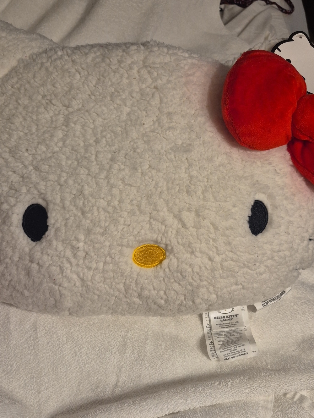 Hello Kitty Sherpa Face Cushion in White with Red Bow